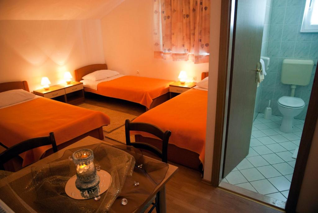 Voodi või voodid majutusasutuse Hotel Metković toas