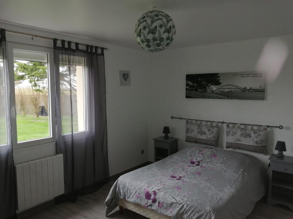 Postel nebo postele na pokoji v ubytování gite repos et tranquillité G