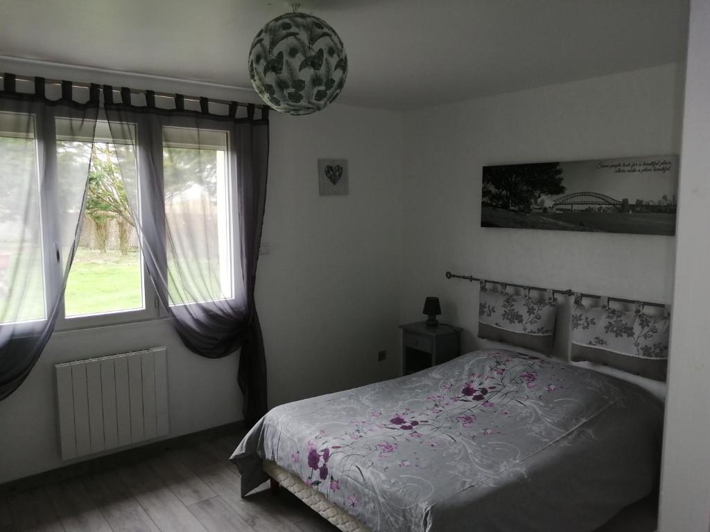 Postel nebo postele na pokoji v ubytování gite repos et tranquillité G