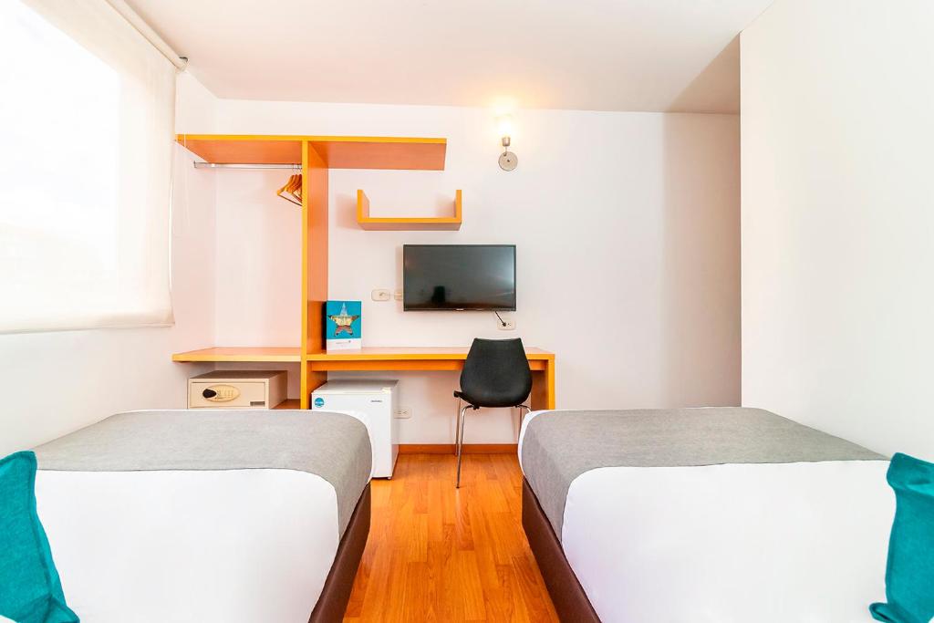TV a/nebo společenská místnost v ubytování Hotel Abitare 56