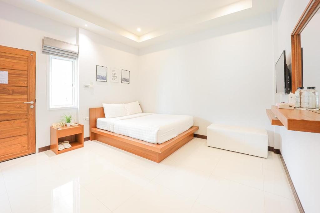 Postel nebo postele na pokoji v ubytování AKARD Private Villas Sattahip