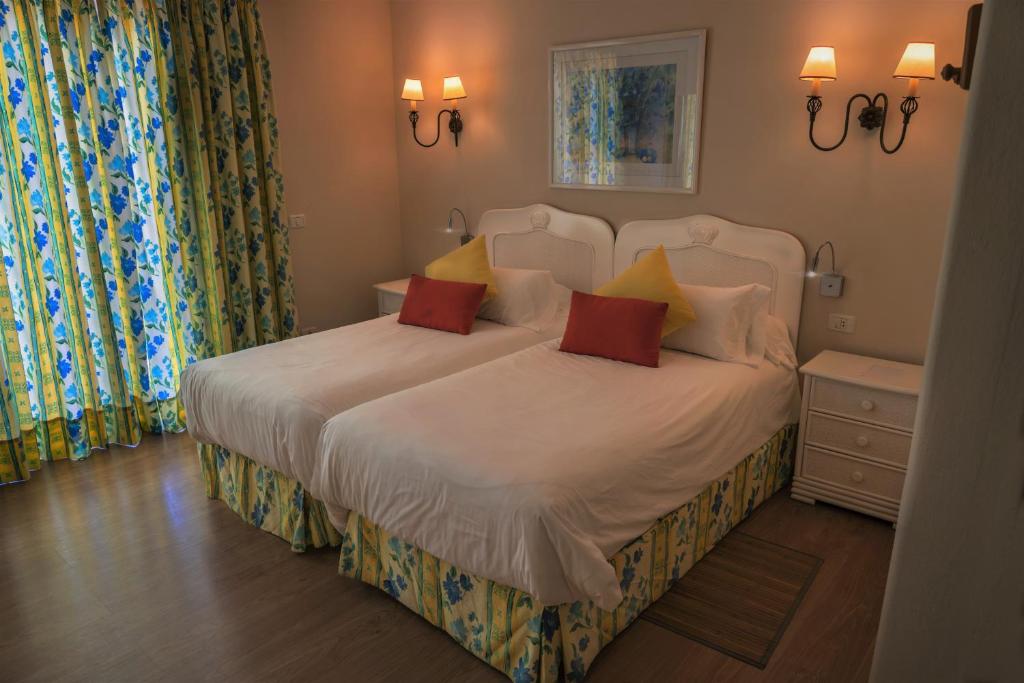 Postel nebo postele na pokoji v ubytování La Palma Jardín Resort