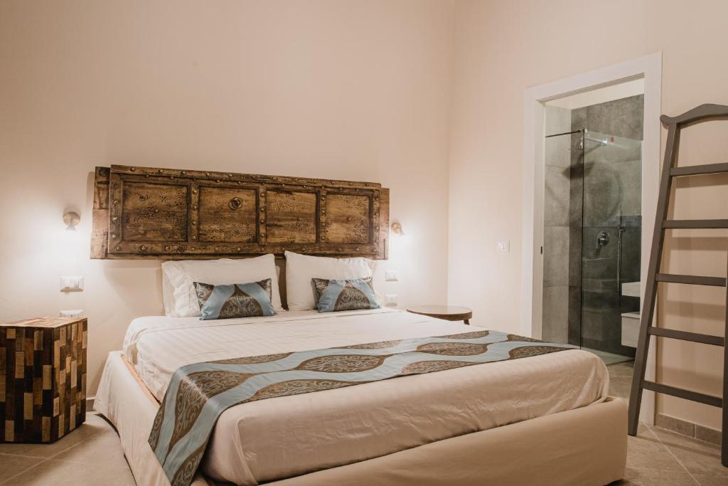Posteľ alebo postele v izbe v ubytovaní Moon's Tower suite&rooms