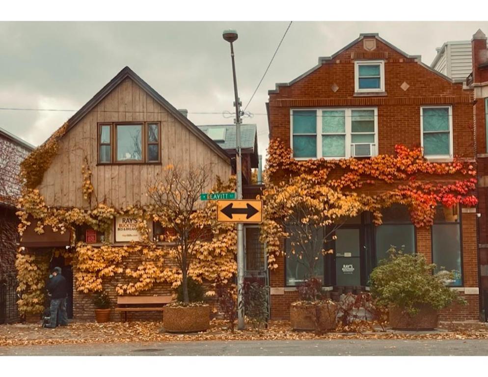 a house on a street with leaves in front of it at Ray's Bucktown Bed and Breakfast in Chicago
