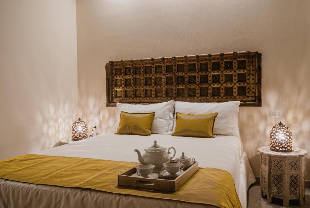Posteľ alebo postele v izbe v ubytovaní Moon's Tower suite&rooms