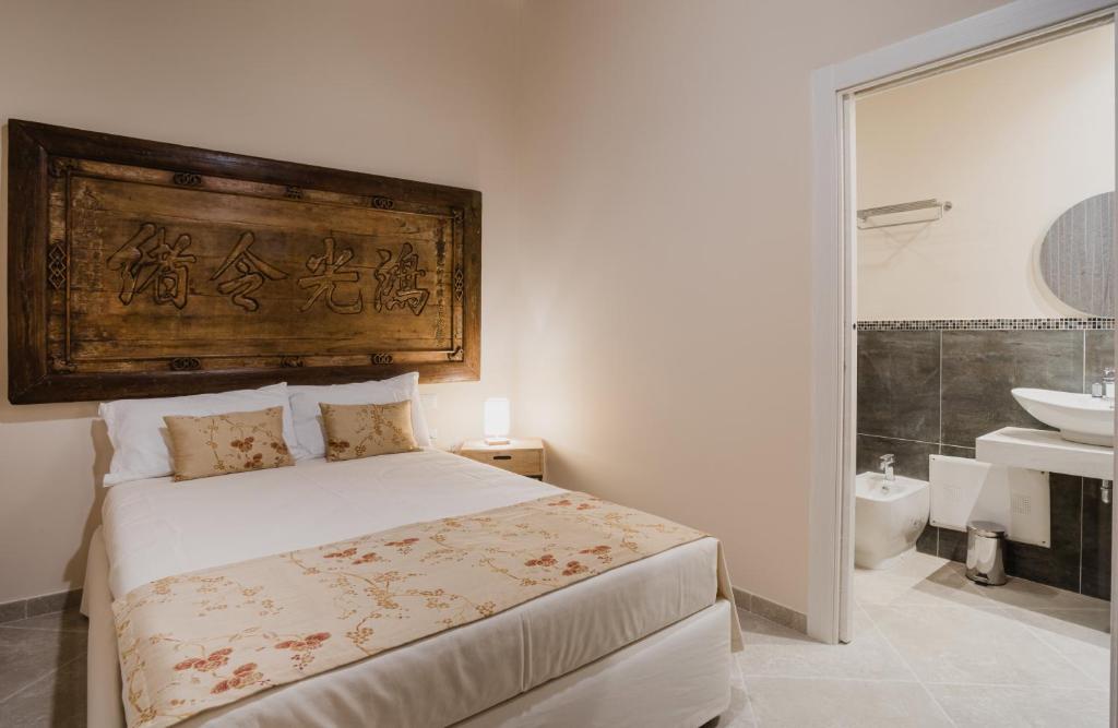 Posteľ alebo postele v izbe v ubytovaní Moon's Tower suite&rooms
