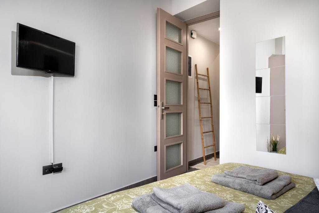 A television and/or entertainment centre at New Apartment in the Heart of Plaka