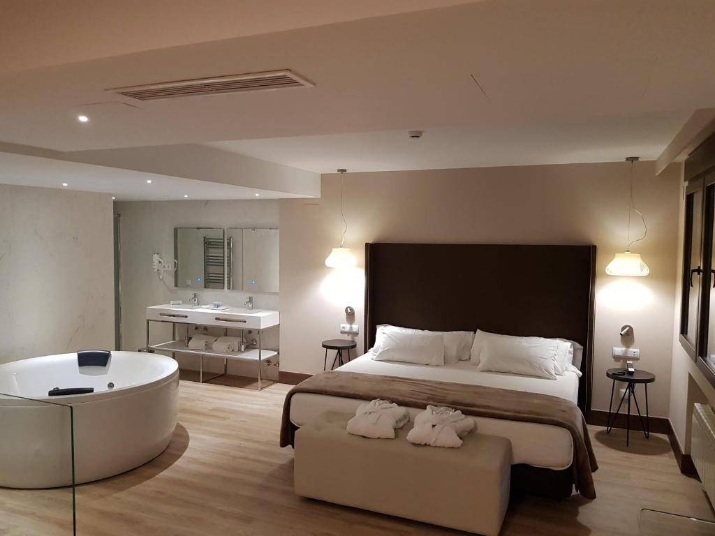 Postel nebo postele na pokoji v ubytování Hotel Maria Cristina