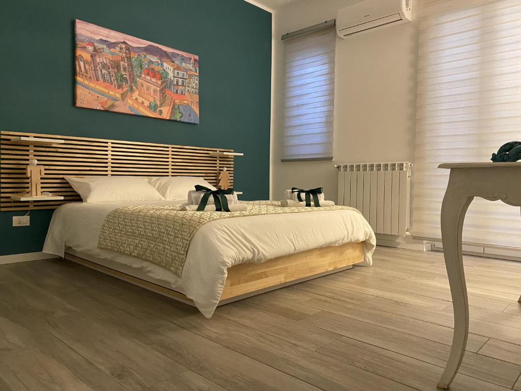 Łóżko lub łóżka w pokoju w obiekcie casa vacanze Sleep Art