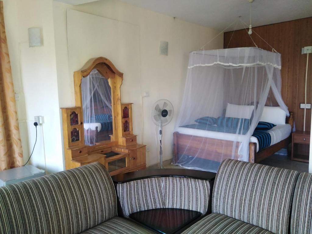 Postel nebo postele na pokoji v ubytování Blue Ribbon Homestay