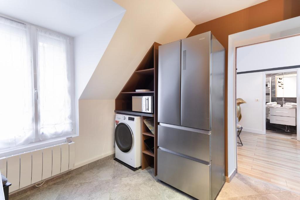 Kuchyň nebo kuchyňský kout v ubytování Suite Appart Place Versepuy