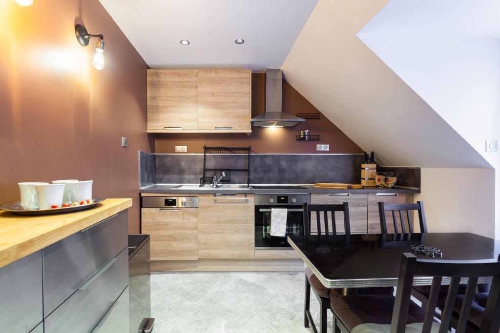 Kuchyň nebo kuchyňský kout v ubytování Suite Appart Place Versepuy