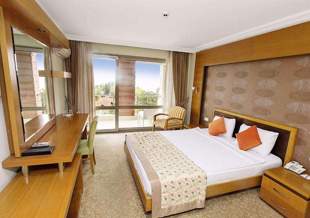 Postel nebo postele na pokoji v ubytování Sırma Hotel