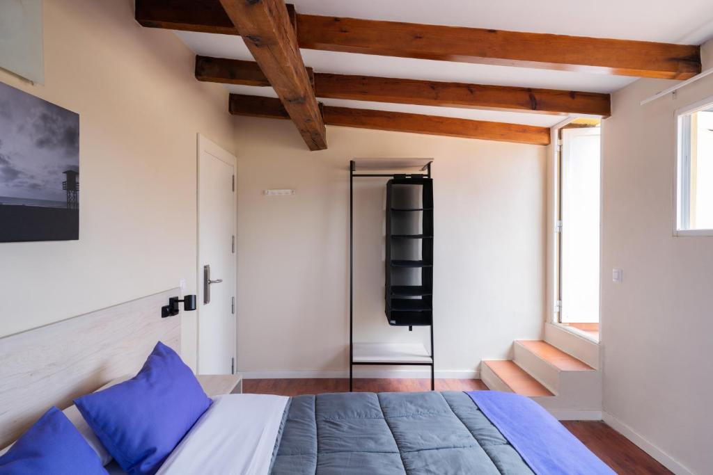 Postel nebo postele na pokoji v ubytování Purple Nest Hostel