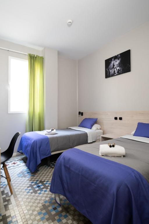 Postel nebo postele na pokoji v ubytování Purple Nest Hostel