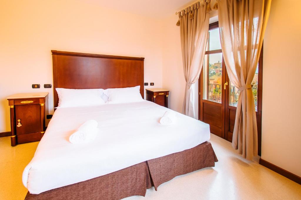Postel nebo postele na pokoji v ubytování Hotel Villa Lauri