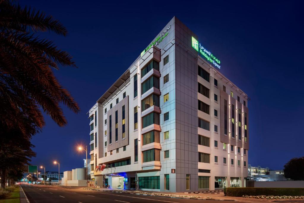 a rendering of a hotel at night at Holiday Inn Express Dubai, Jumeirah, an IHG Hotel in Dubai