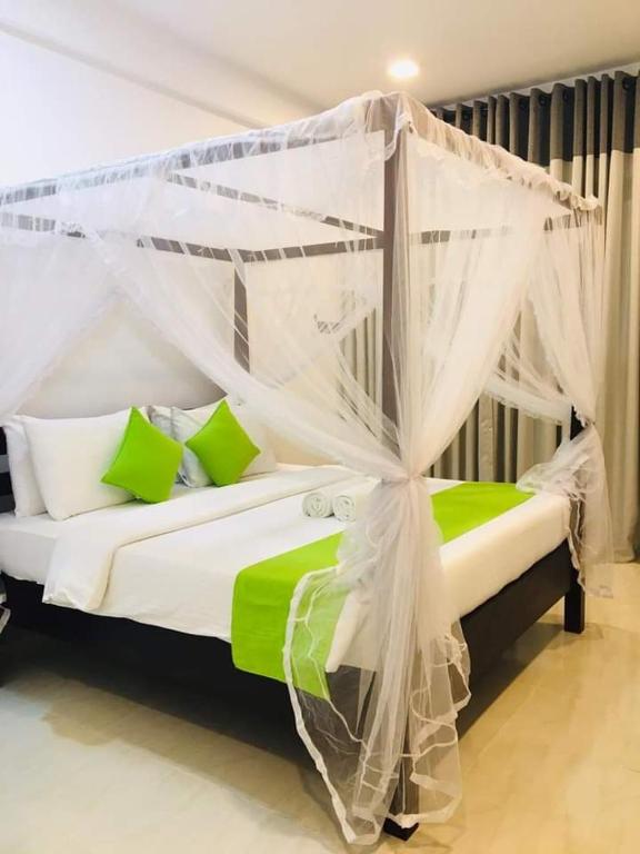 Postel nebo postele na pokoji v ubytování Golden Ray villa