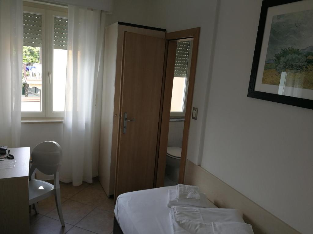 Postel nebo postele na pokoji v ubytování Hotel Sirena