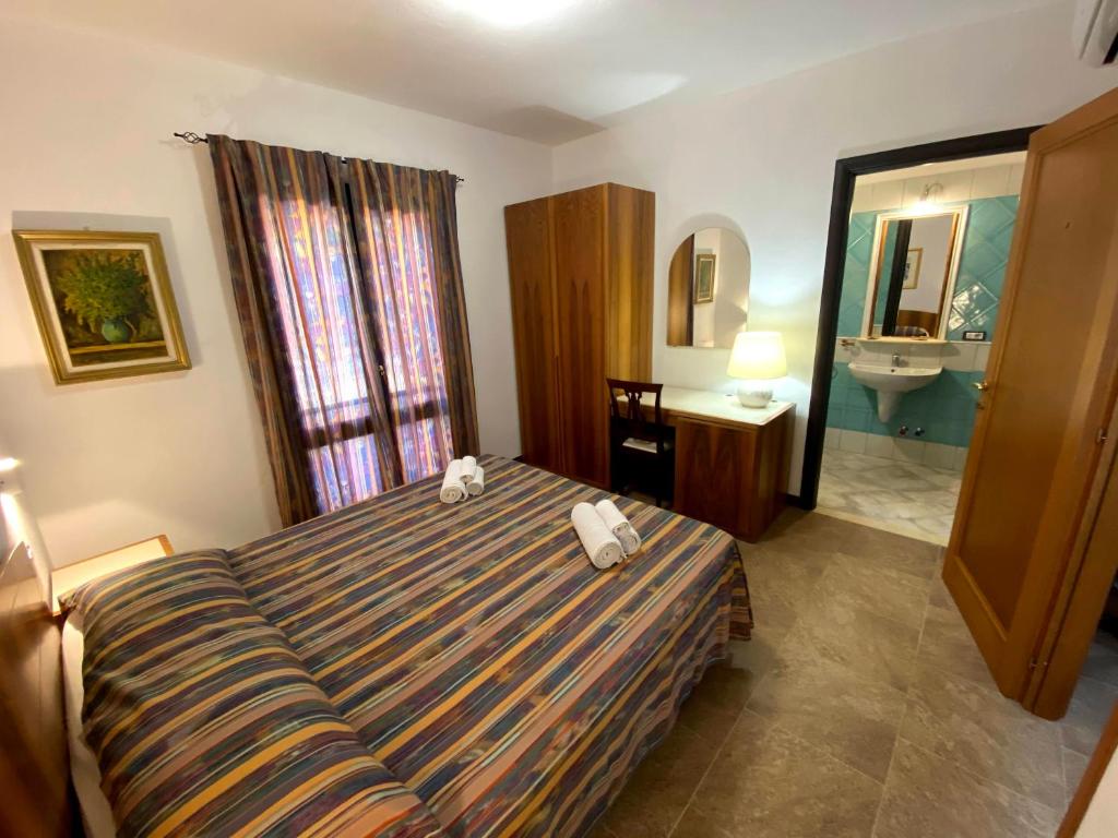Postel nebo postele na pokoji v ubytování Villa Silvana