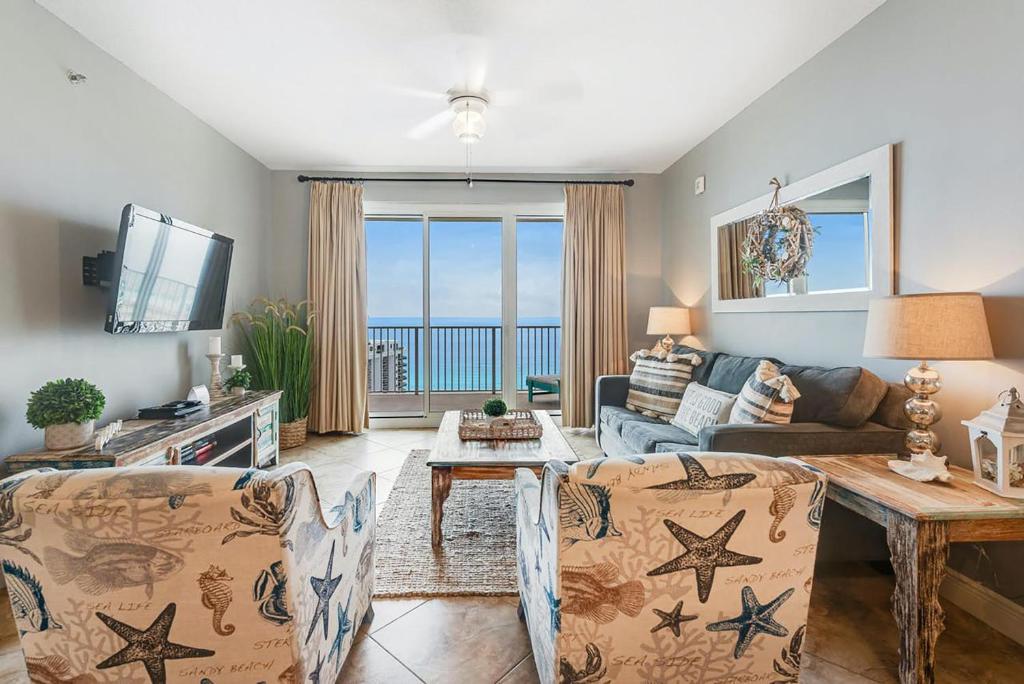 a living room with a view of the ocean at Ariel Dunes I 2207 in Destin