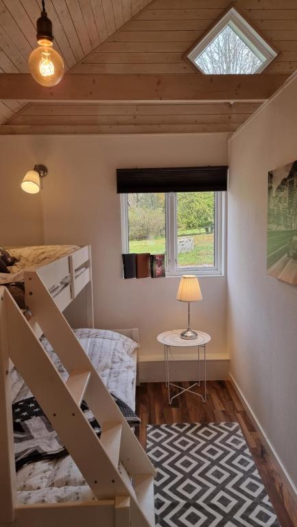 Postel nebo postele na pokoji v ubytování Anhults Garden