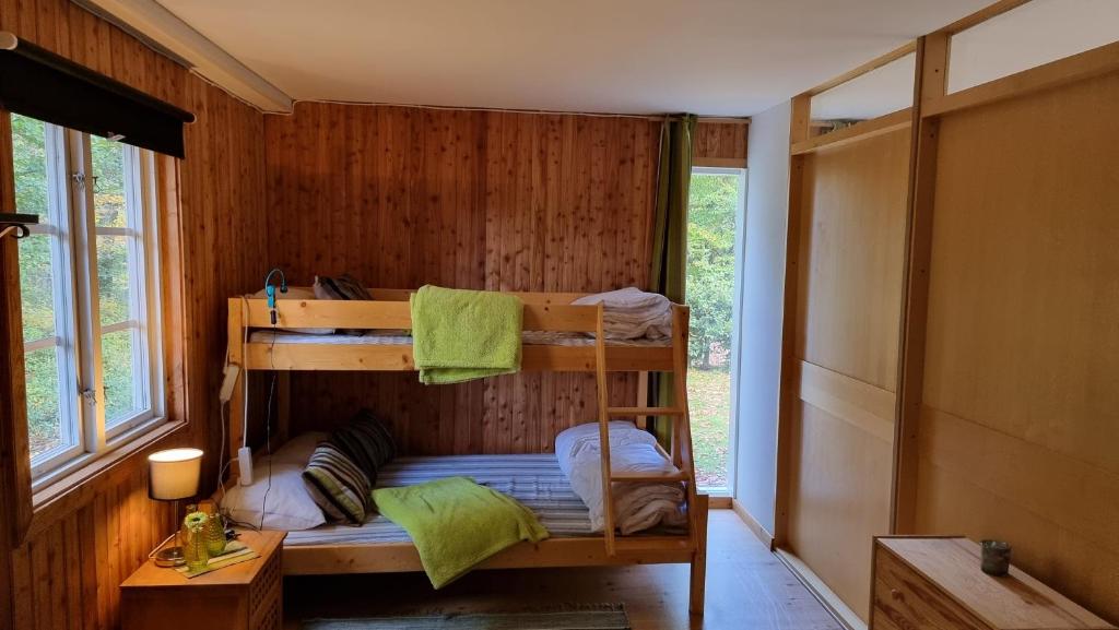Postel nebo postele na pokoji v ubytování Anhults Garden