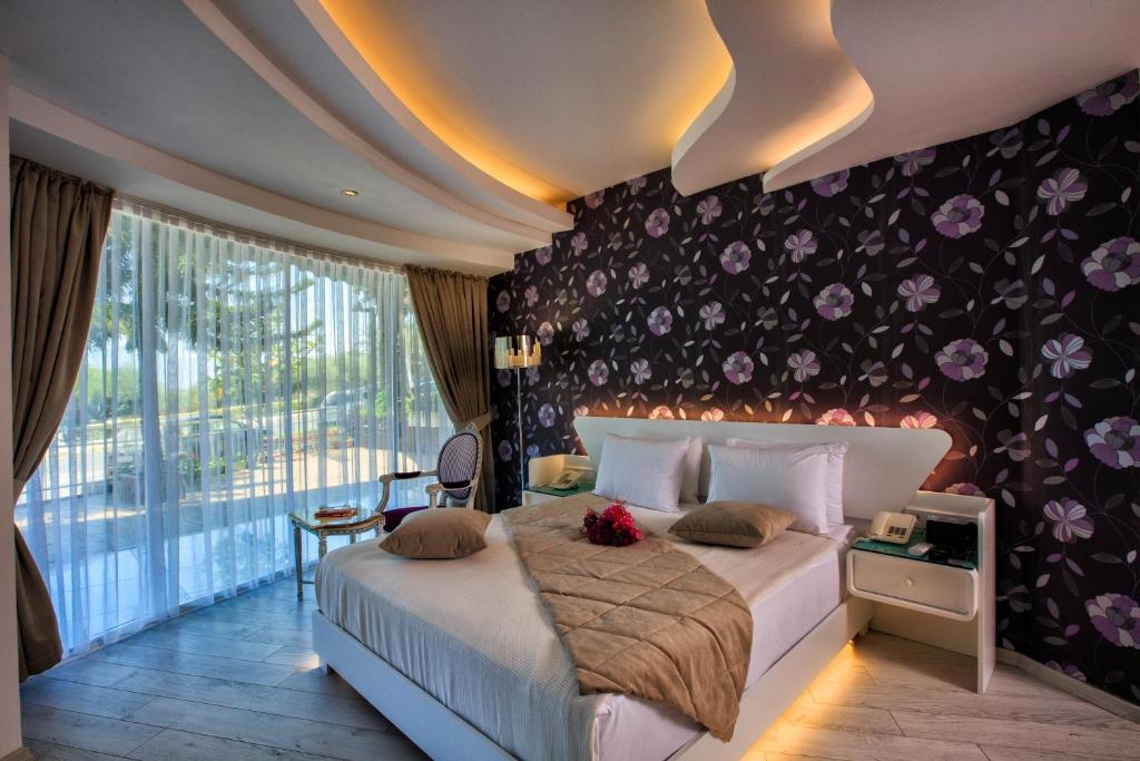 Postel nebo postele na pokoji v ubytování Ata Park Hotel