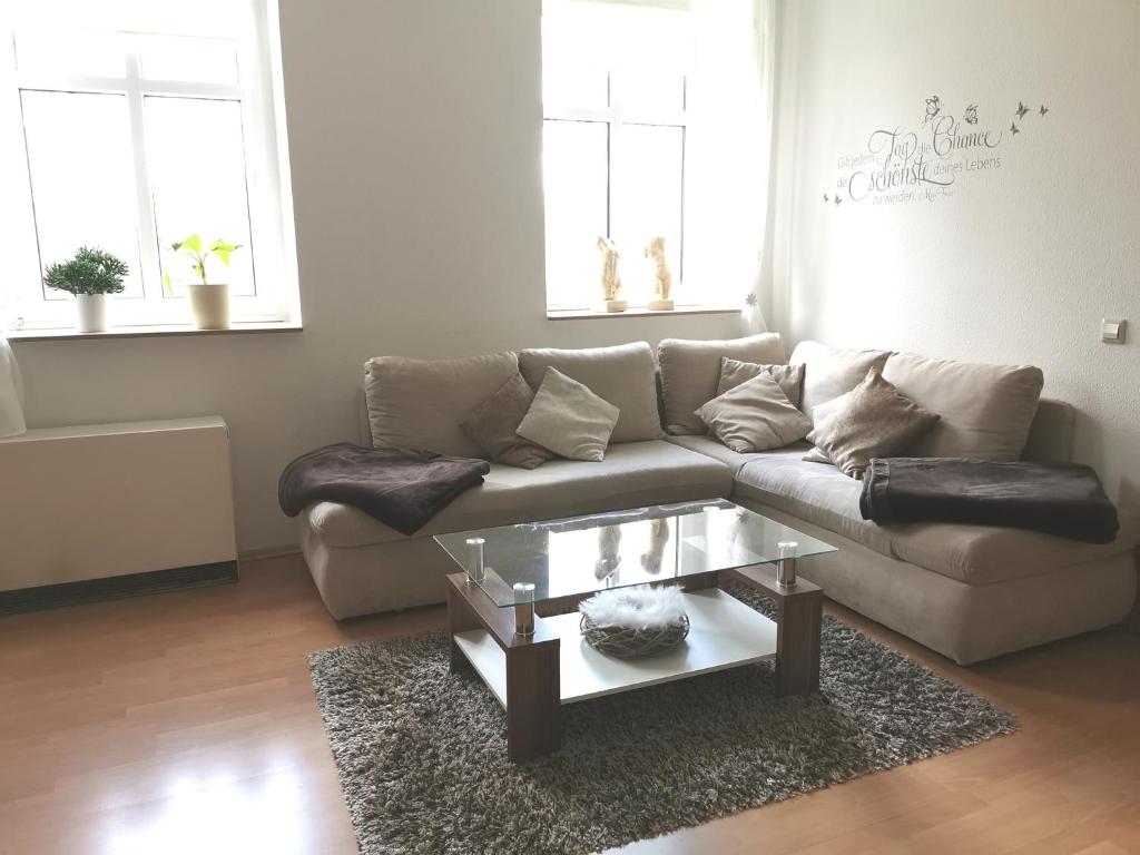 a living room with a couch and a coffee table at Ferienwohnung Czampiel in Havelberg