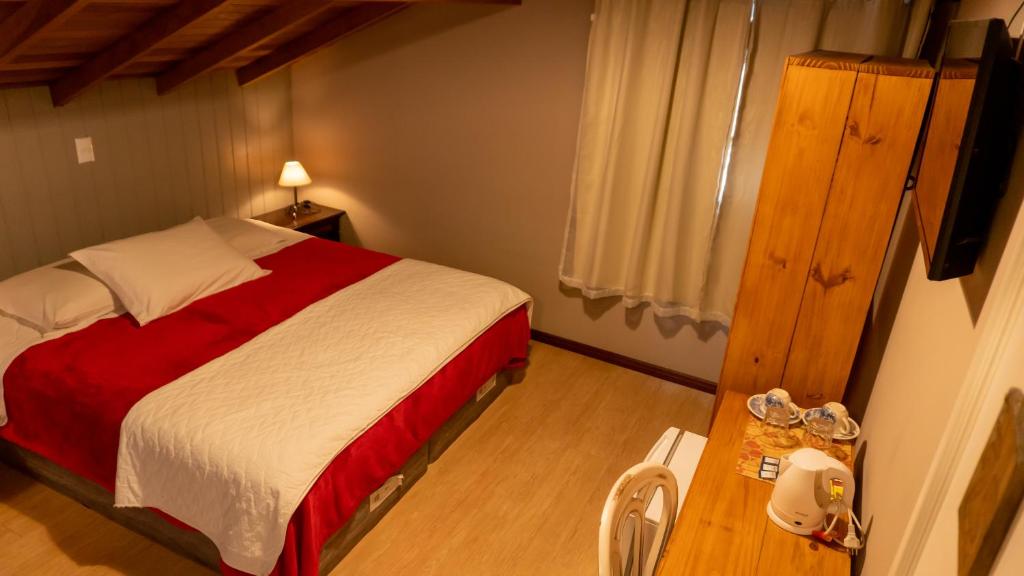 Uma cama ou camas num quarto em Aardvark Inn Pousada