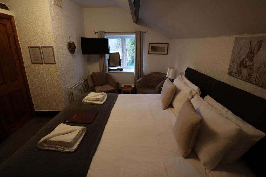 Postel nebo postele na pokoji v ubytování The George Inn