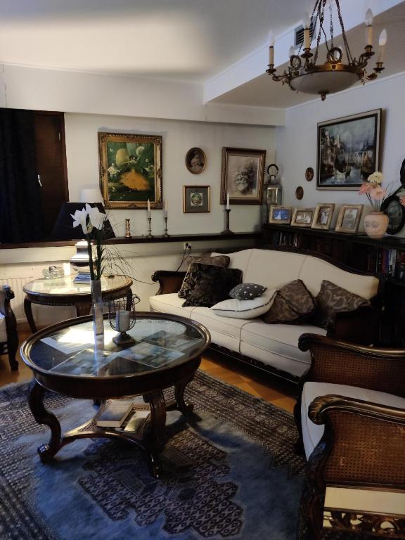a living room with a couch and a table at Apartment Nonna in Keuruu