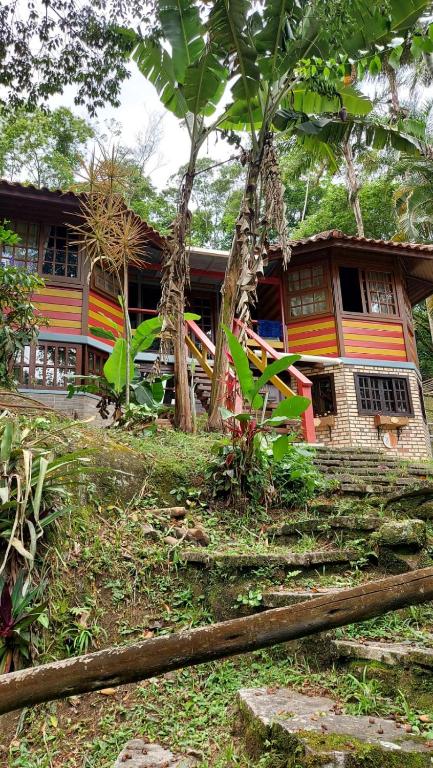 a house with trees in front of it at Monte Carmelo Inn Sana in Sana