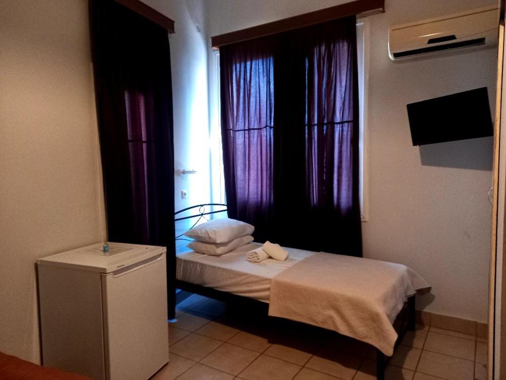 Postel nebo postele na pokoji v ubytování Hotel Korydallos