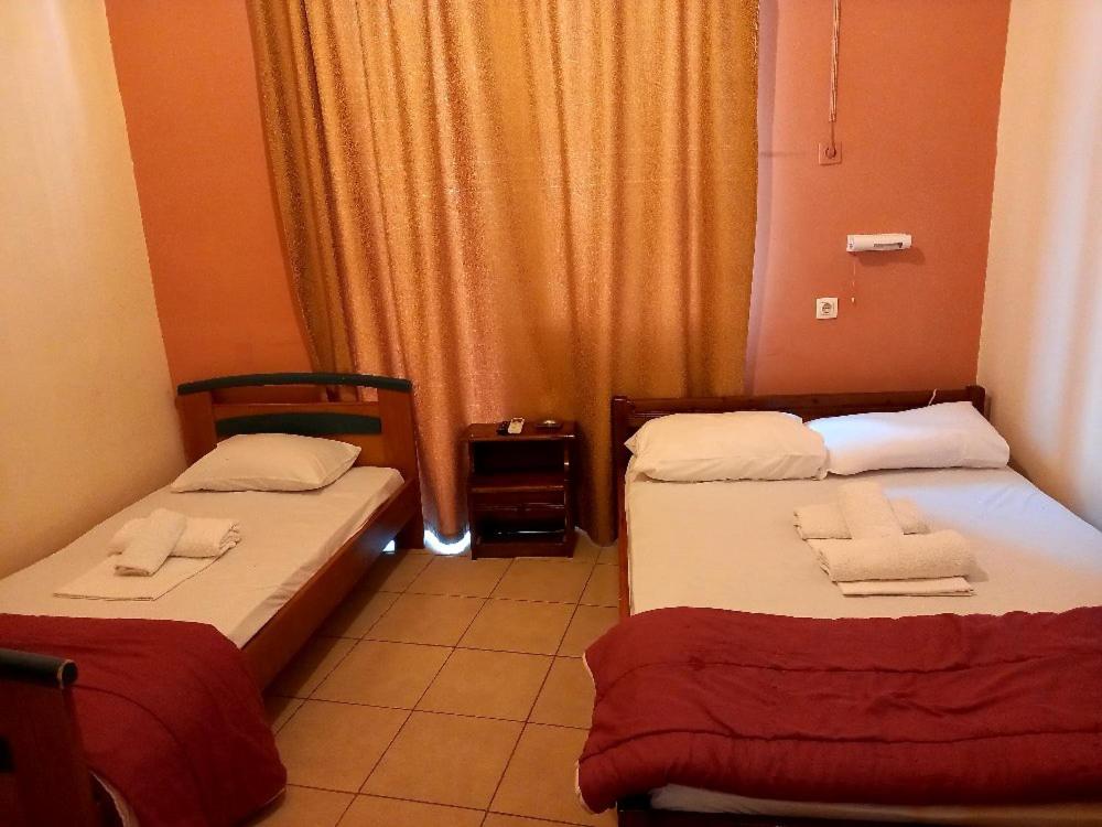 Postel nebo postele na pokoji v ubytování Hotel Korydallos