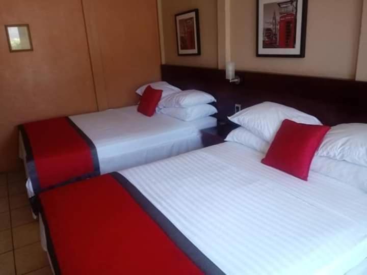 Postel nebo postele na pokoji v ubytování Hotel Boutique Malibu Los Sueños