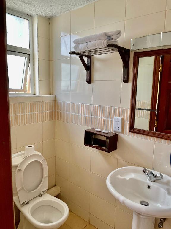 Koupelna v ubytování Kenya Comfort Suites