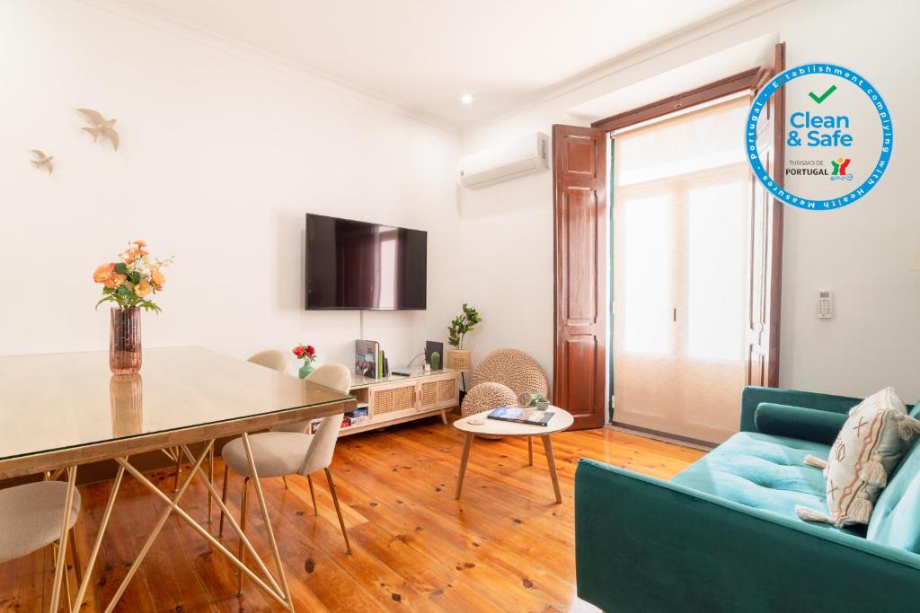 a living room with a couch and a table at Your New Home in Lisbon - AC and Fast Wi-Fi in Lisbon