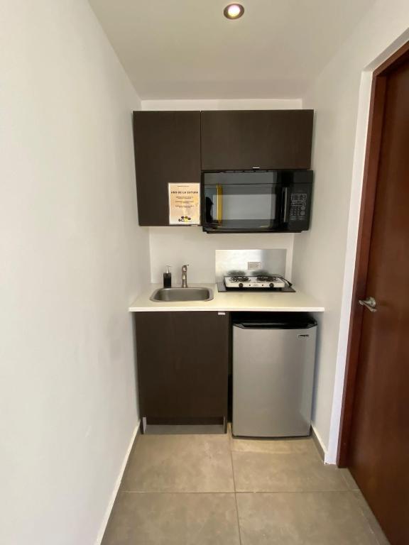 Kuchyň nebo kuchyňský kout v ubytování Hotel Nest