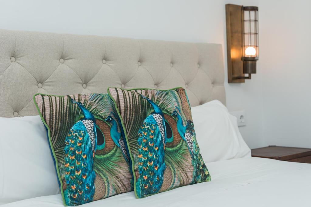 A bed or beds in a room at La SIGRINA Tuy