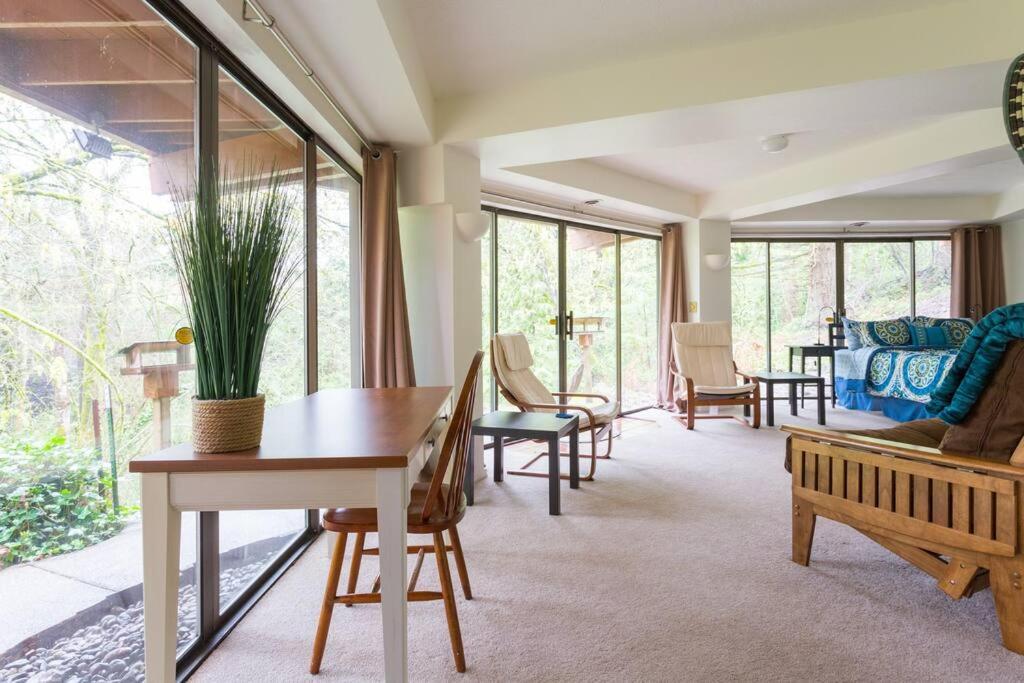 a living room with a table and chairs at Bright, Unique Apartment in Heart of Wine Country in Newberg