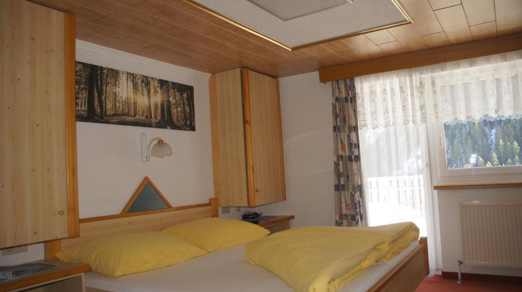 Postel nebo postele na pokoji v ubytování Apart Garni Dorfblick