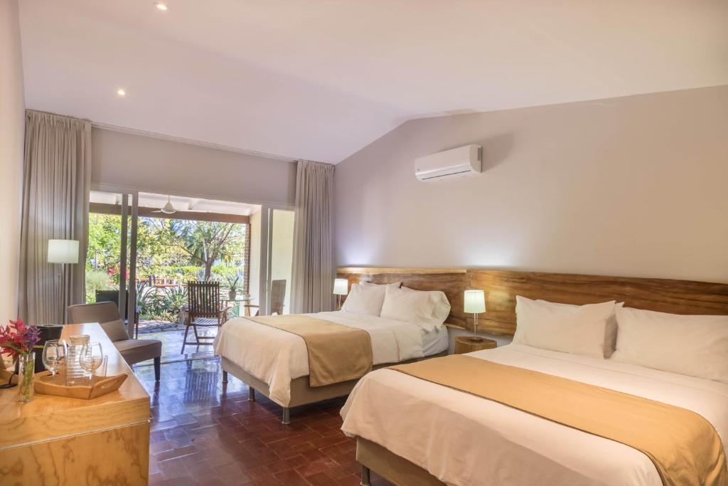 Katil atau katil-katil dalam bilik di OPacifico Hotel Boutique