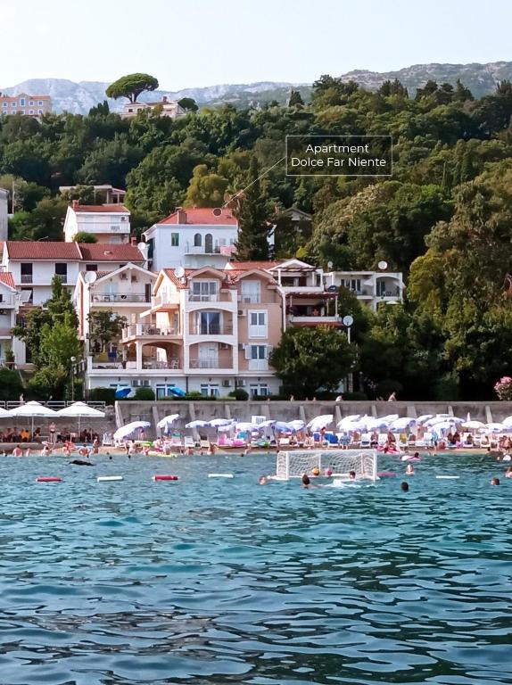 a view of a beach with people in the water at Dolce Far Niente in Herceg-Novi
