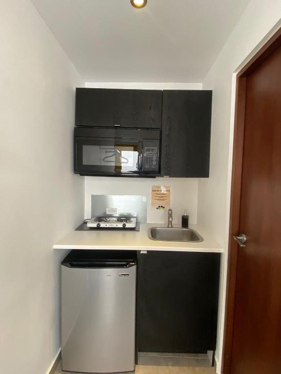 Kuchyň nebo kuchyňský kout v ubytování Hotel Nest