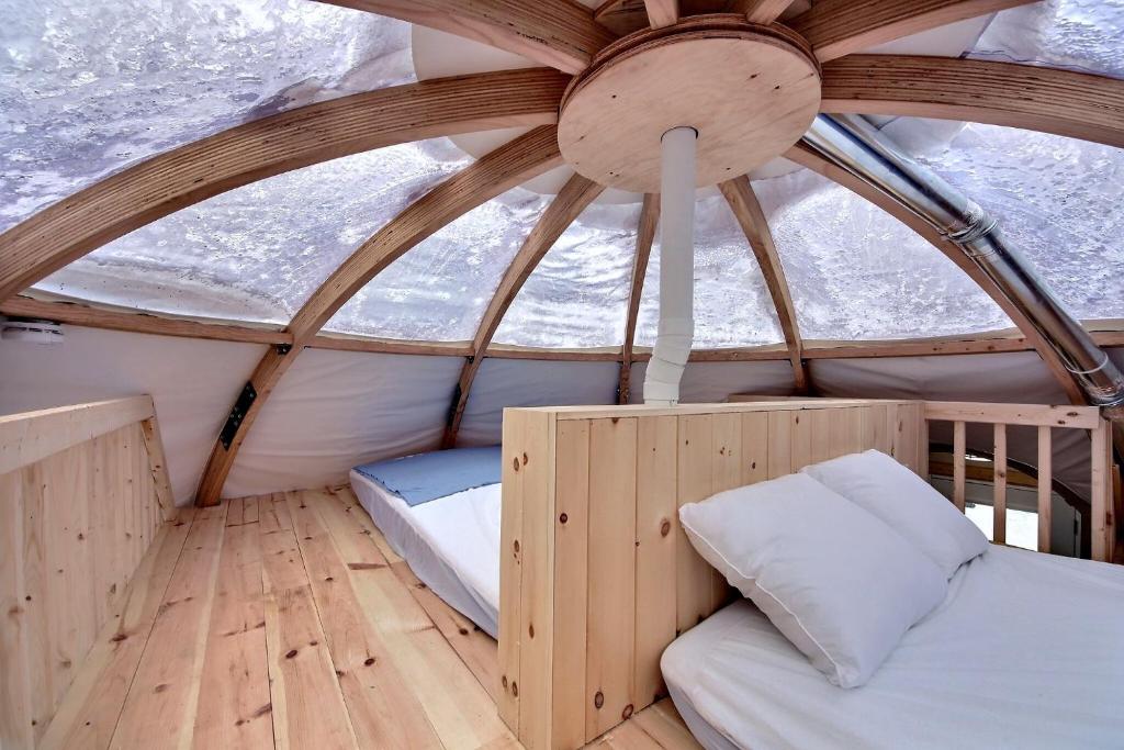 Postel nebo postele na pokoji v ubytování Imago Village