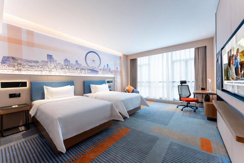 TV a/nebo společenská místnost v ubytování Hampton by Hilton Guangzhou Jinshazhou