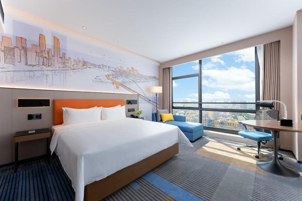 Postel nebo postele na pokoji v ubytování Hampton by Hilton Guangzhou Jinshazhou