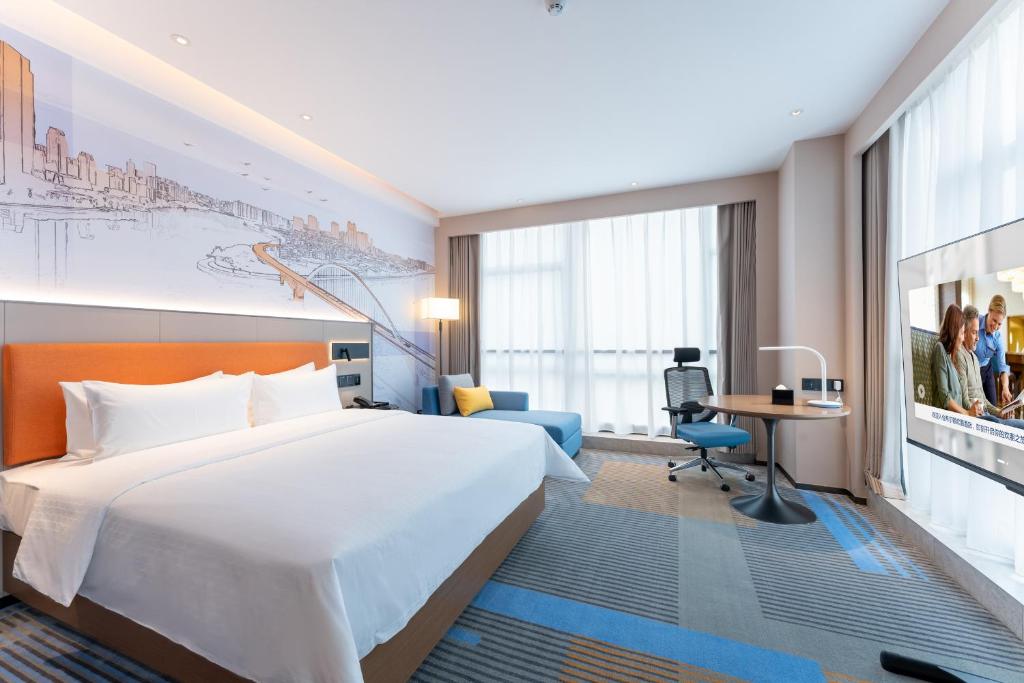Postel nebo postele na pokoji v ubytování Hampton by Hilton Guangzhou Jinshazhou