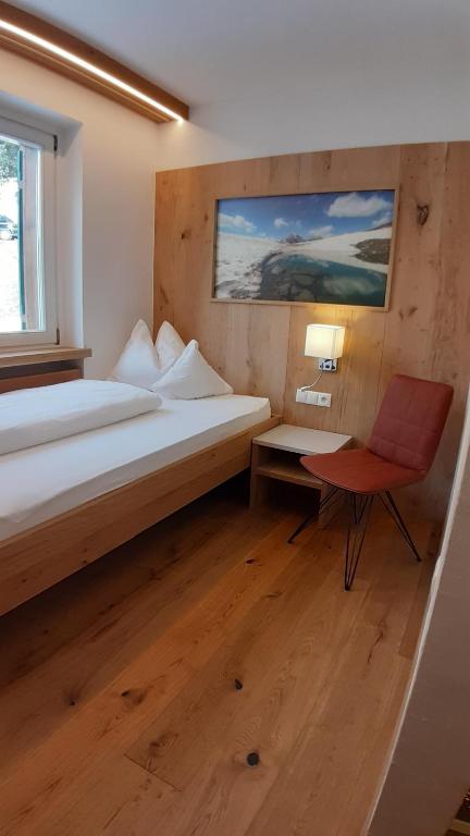 Postel nebo postele na pokoji v ubytování Pension Panorama